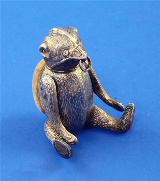 An Edwardian novelty silver articulated bear pin cushion, 60mm.